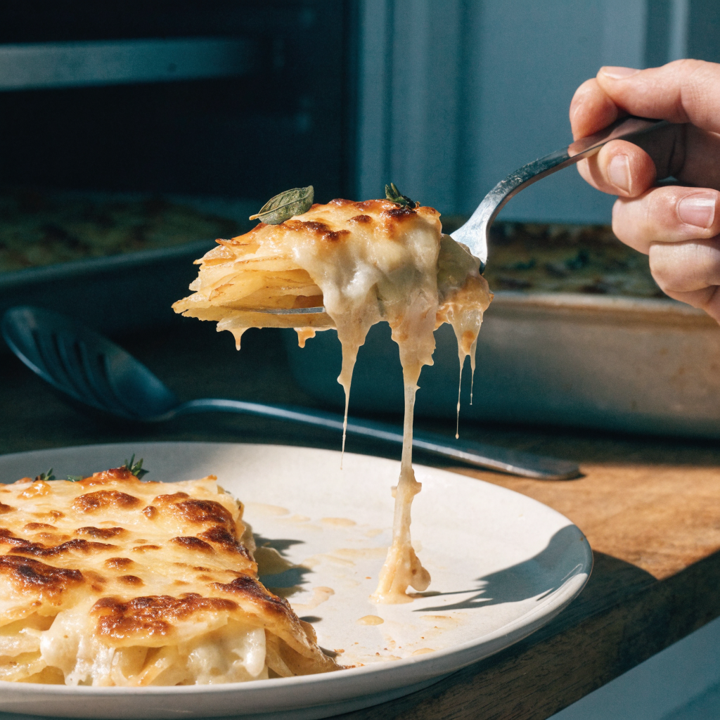 Close-up of reliable potato gratin with warmed cream and gruyère