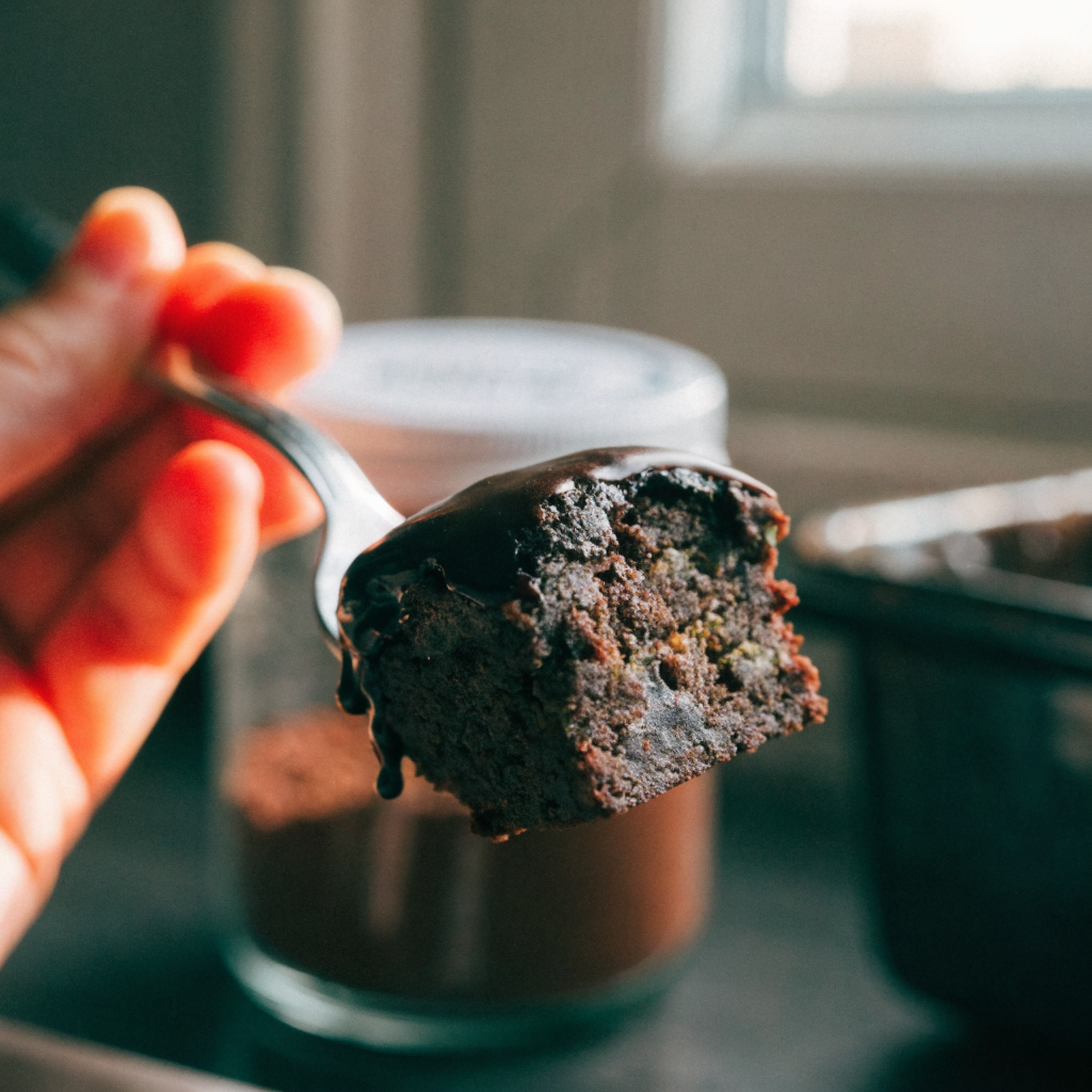 Close-up of fudgy zucchini brownies with quick chocolate glaze